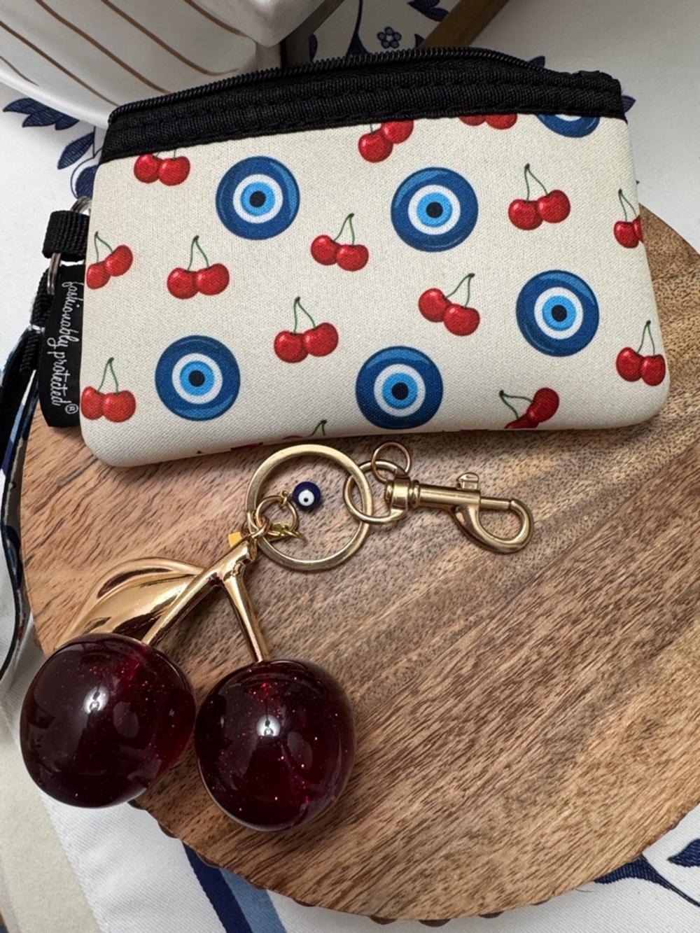 Fashionably Protected Cherry & Evil Eye Wristlet Pouch – Cream